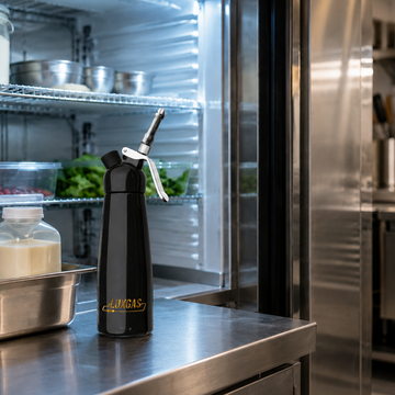 LUXGAS whipped cream dispenser in a refrigerated professional kitchen for safe whipped cream storage